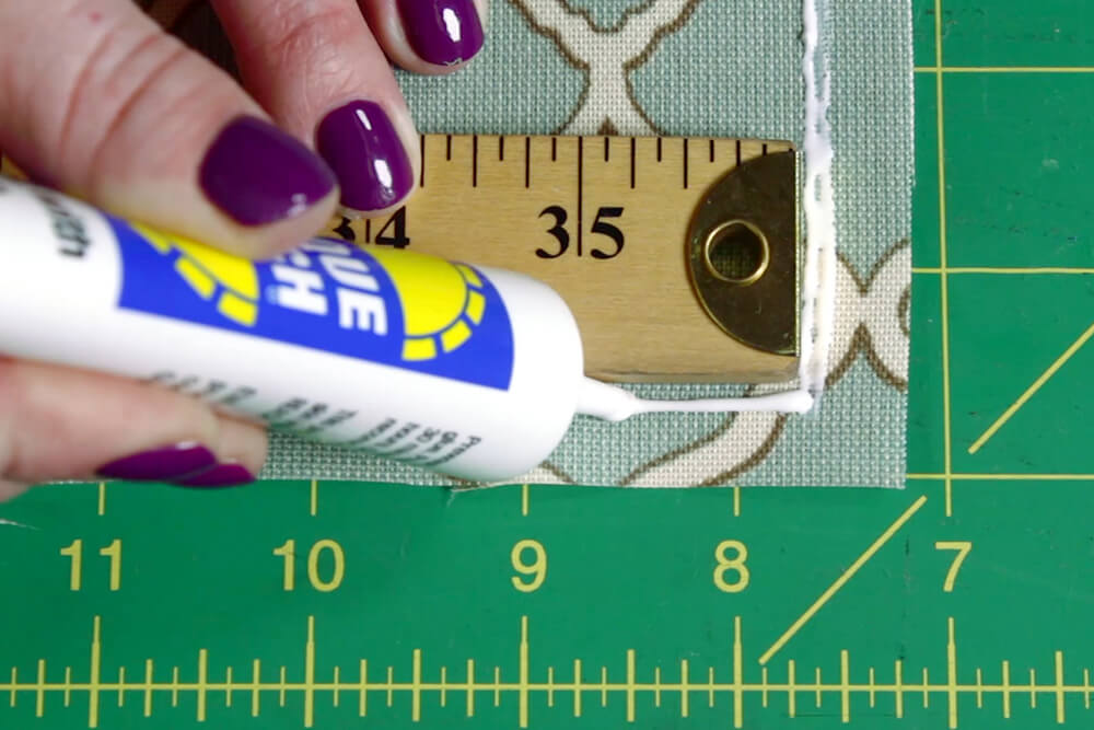 What is the best fabric glue to attach this patch to a onesie quilt? (It  has adhesive but it recommends using fabric glue too) : r/quilting
